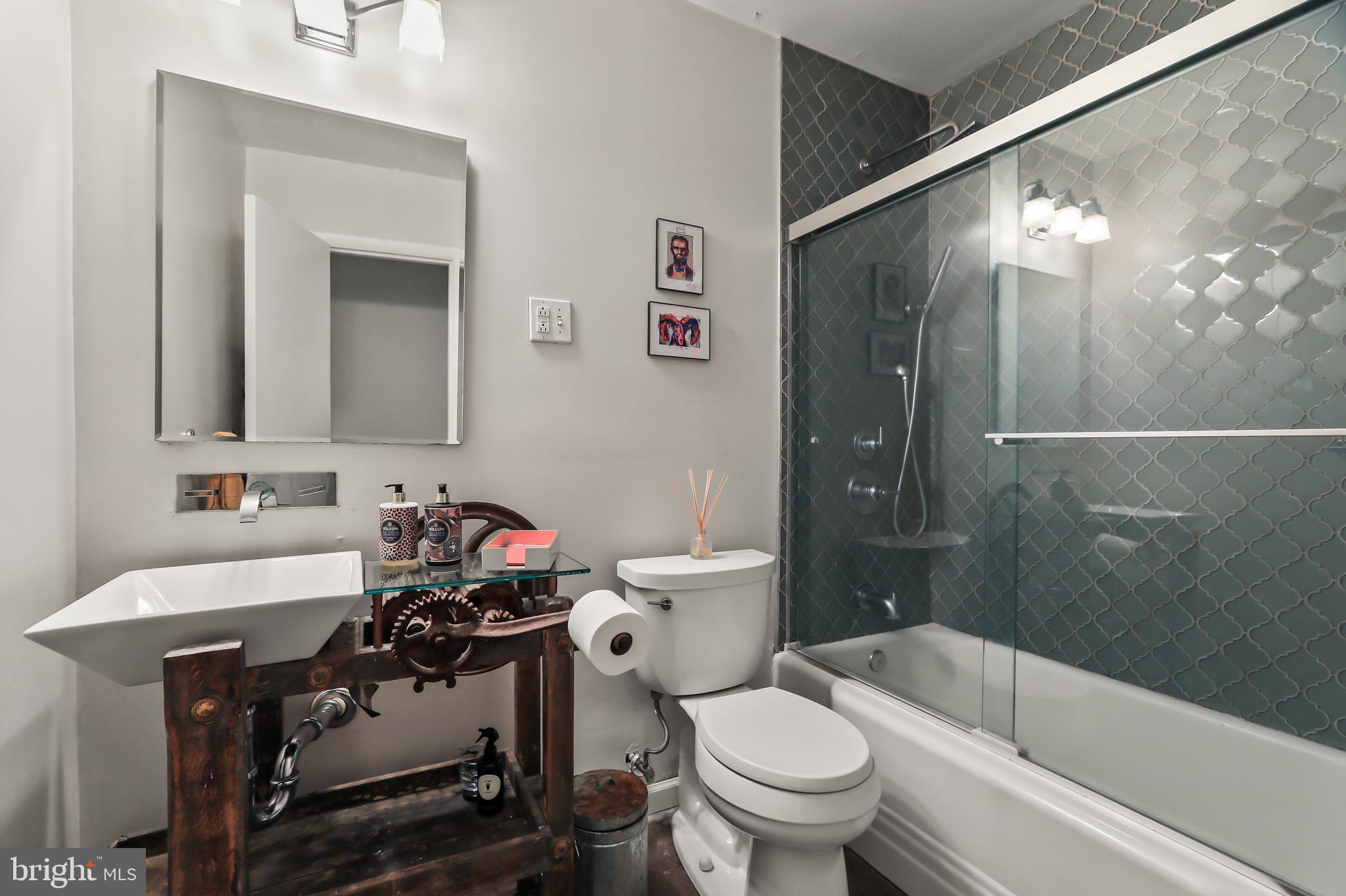 1004 Mercer Road Princeton, NJ 08540 - Photo 18 of 28 a bathroom with a sink toilet and shower