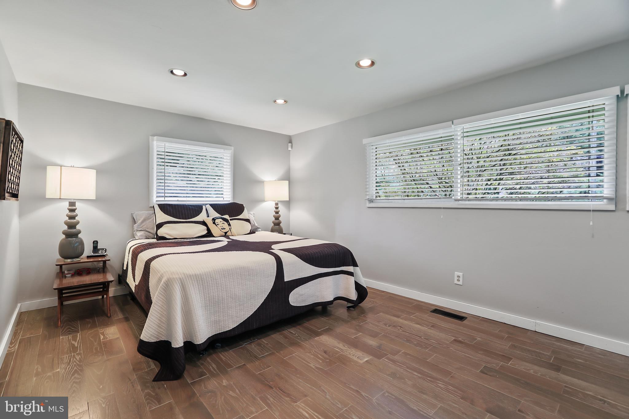 1004 Mercer Road Princeton, NJ 08540 - Photo 21 of 28 a bedroom with a bed and wooden floor