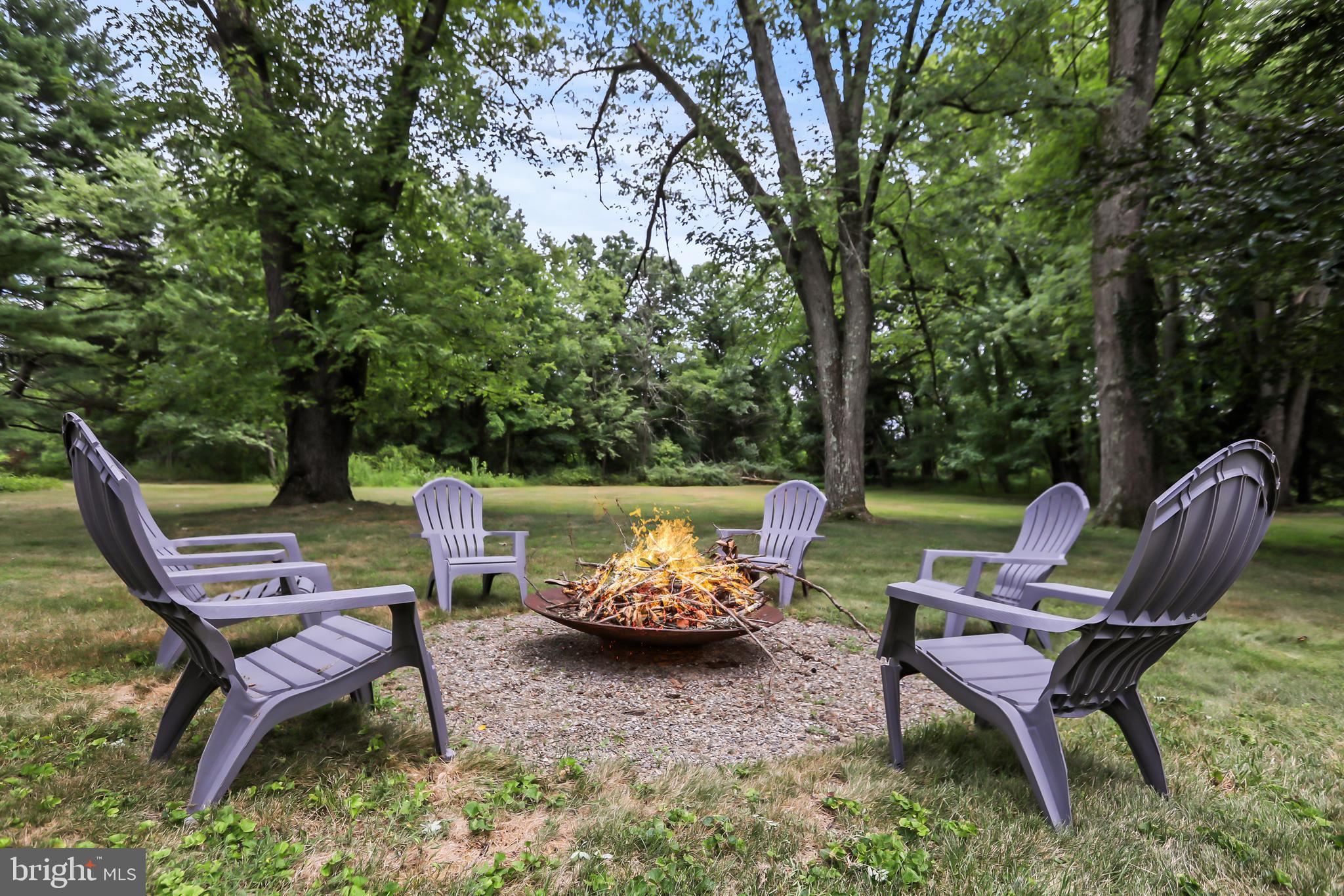 1004 Mercer Road Princeton, NJ 08540 - Photo 25 of 28 a backyard view with a couple of chairs