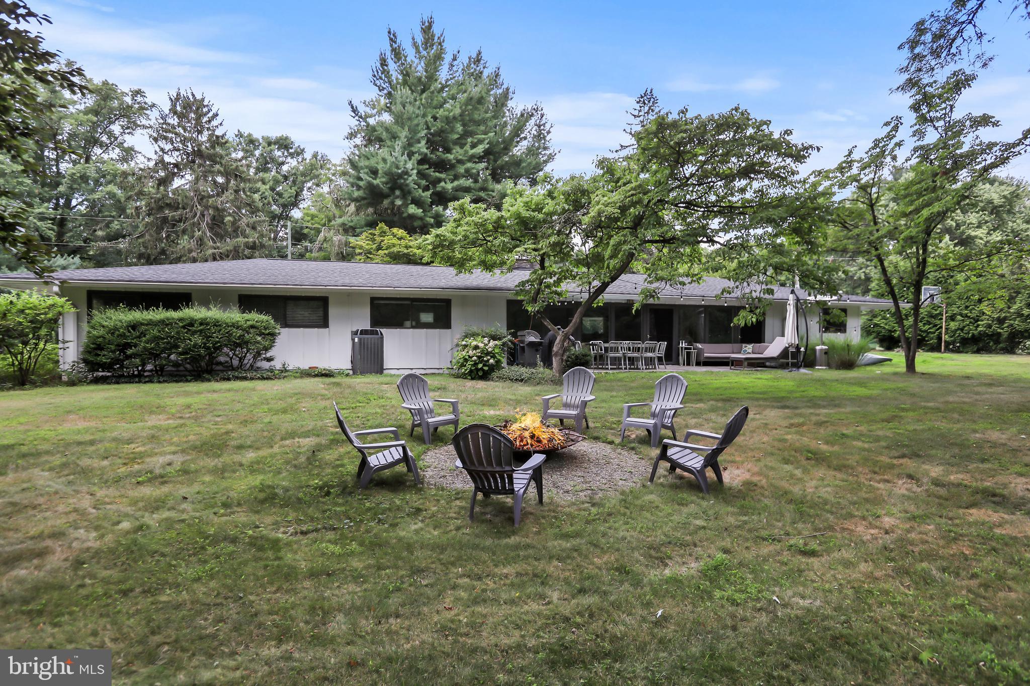 1004 Mercer Road Princeton, NJ 08540 - Photo 26 of 28 a view of a house with backyard sitting area and garden