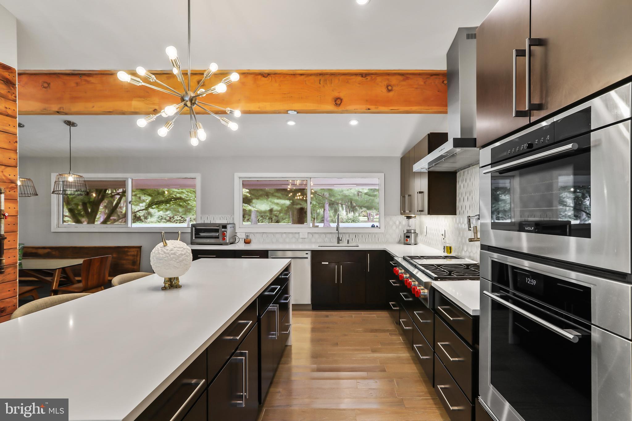 1004 Mercer Road Princeton, NJ 08540 - Photo 9 of 28 a kitchen with stainless steel appliances a sink a stove and a microwave