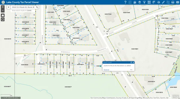 a white cabinet with black white and next to a white refrigerator