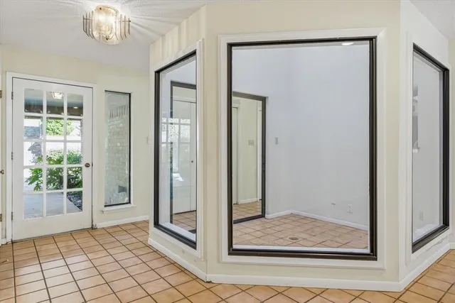 a view of a livingroom with furniture and chandelier