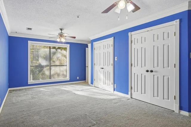 a view of a house with pool and chairs