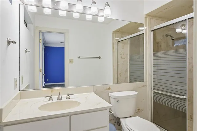 a bedroom with a bed and a chair