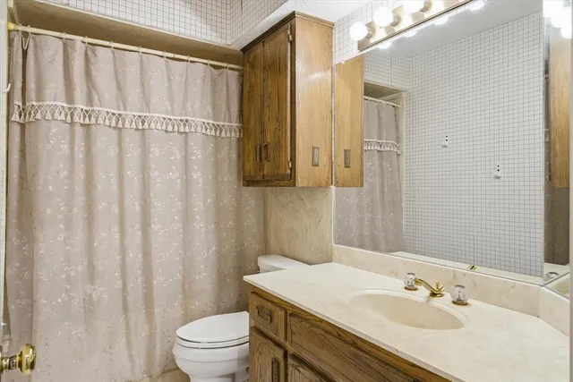 a view of a house with a large tree