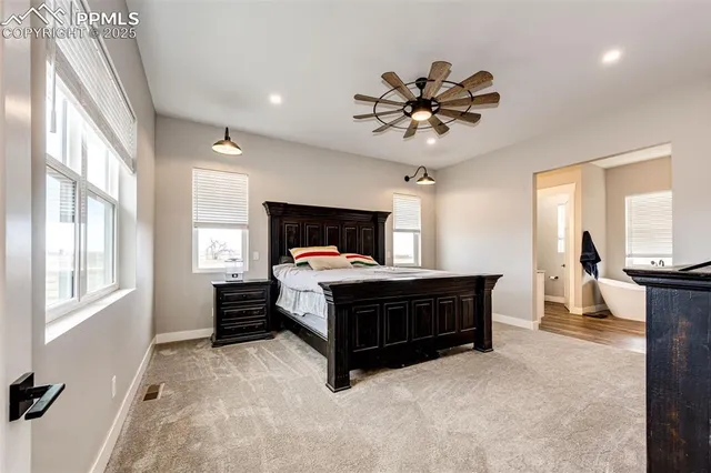 a bed room with a bed and a chandelier