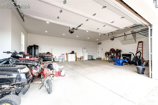 a view of a storage with a bike and car