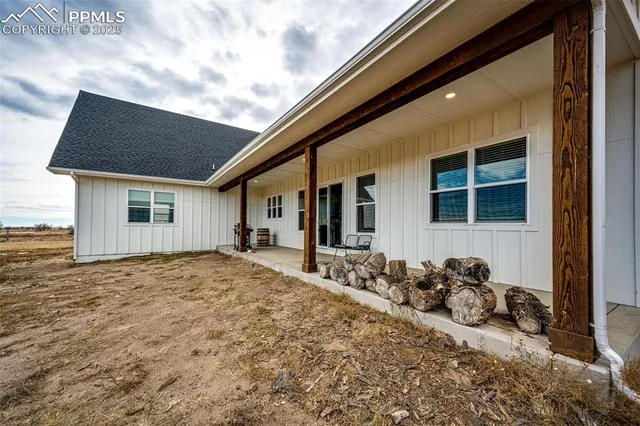 a view of a front door and a car parked front door
