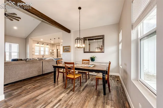 a view of a dining room with furniture window and wooden floor
