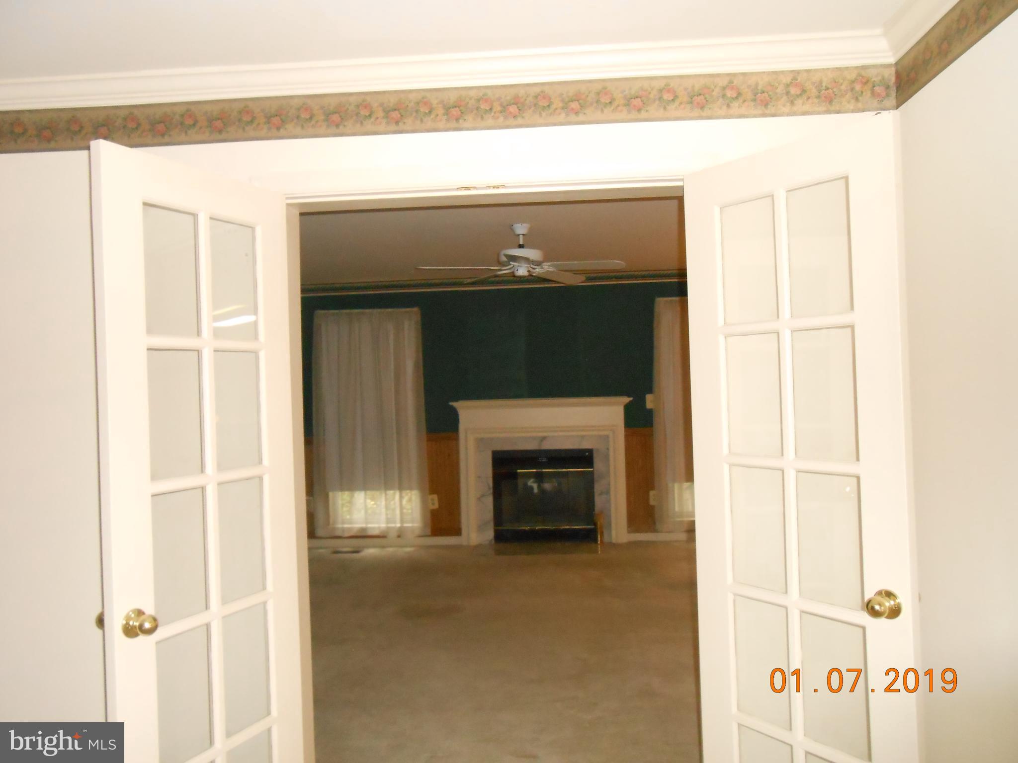 6207 Groveland Road Linthicum, MD 21090 - Photo 8 of 21 FAMILY ROOM LOOKING THROUGH FRENCH DOORS TO FAMILY