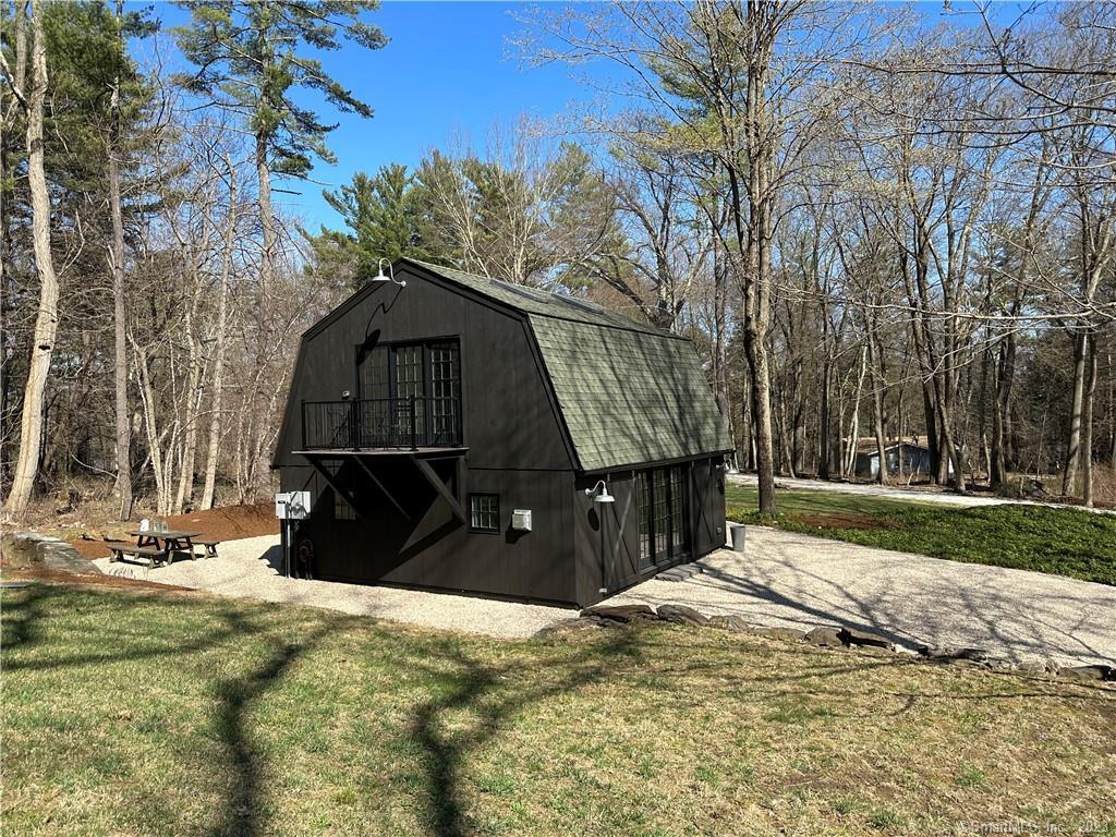 a view of a wooden fence with a trees in the background