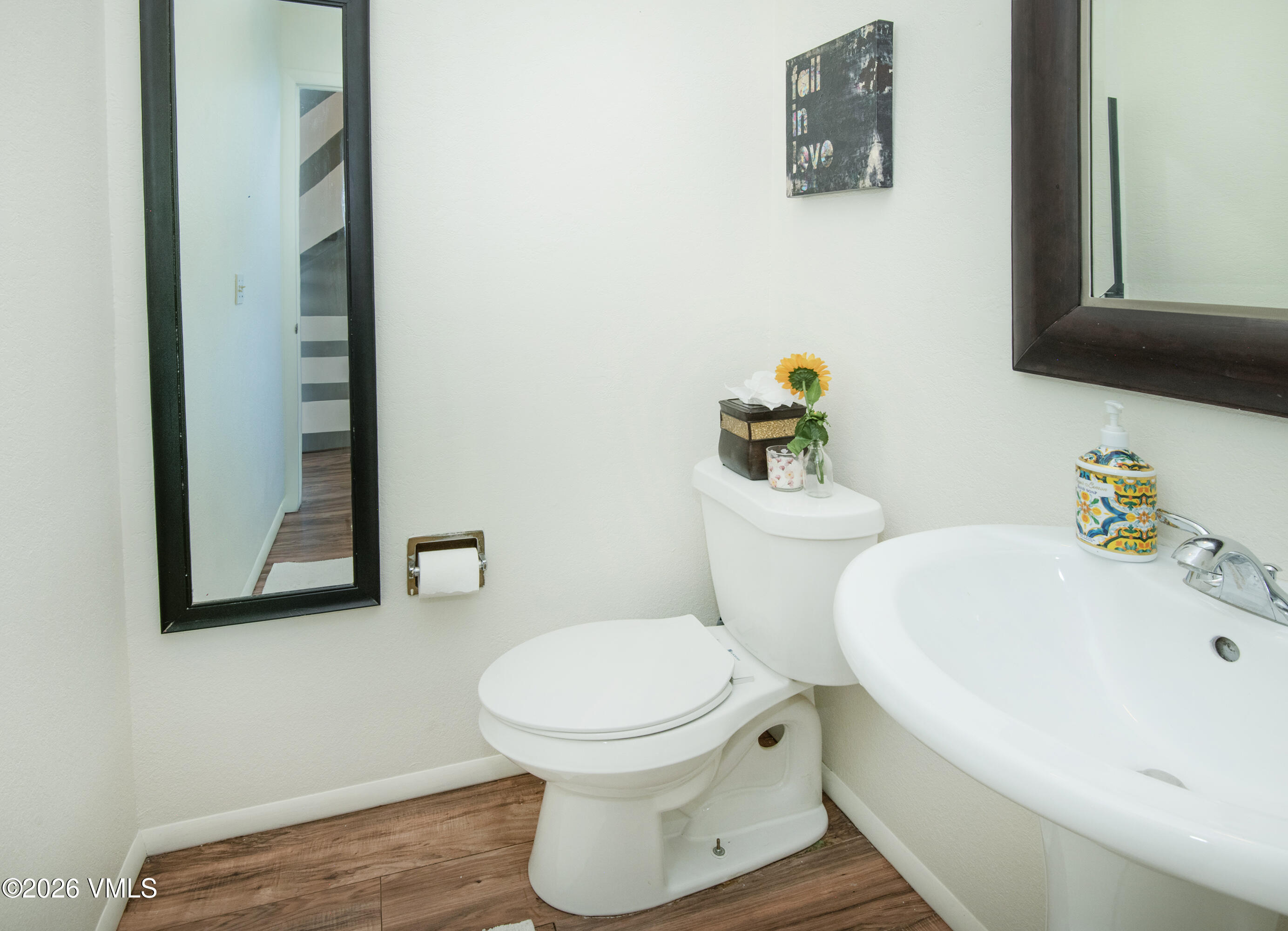 85 Chambers Avenue, Unit 10 Eagle, CO 81631 - Photo 10 of 41 a bathroom with a toilet and a sink