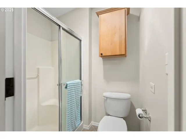 a bedroom with furniture and a wooden floor