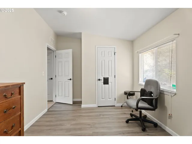 a bedroom with a bed and a bookshelf