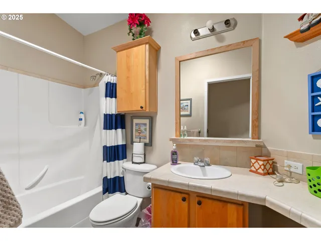 a utility room with closet dryer and washer