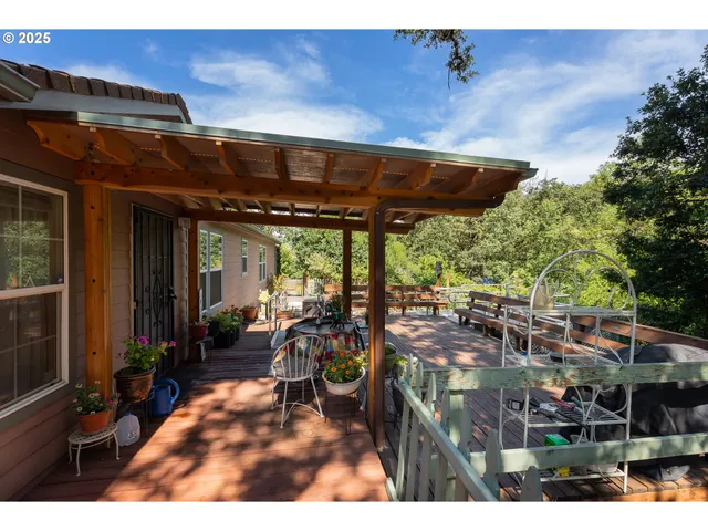 a backyard view with a sitting space