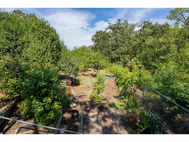 a backyard of a house with wooden fence