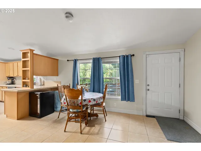 a kitchen with a sink refrigerator and cabinets