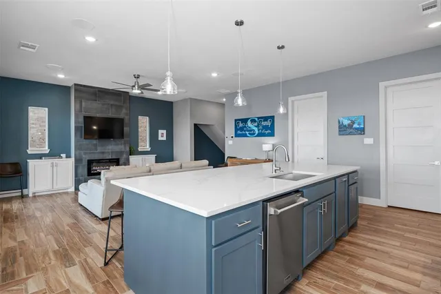 a large kitchen with a table and chairs in it