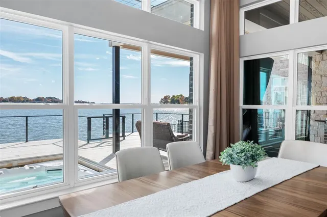 a living room with furniture and large windows