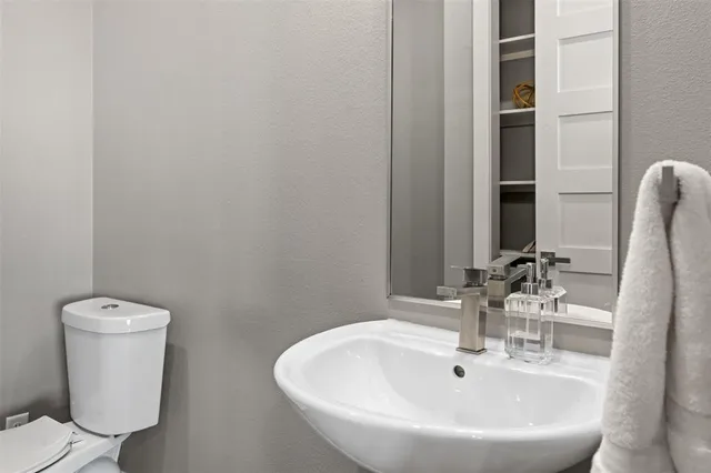 a bathroom with a sink and a toilet