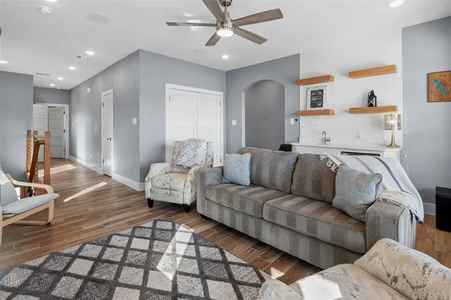 a living room with furniture and a rug