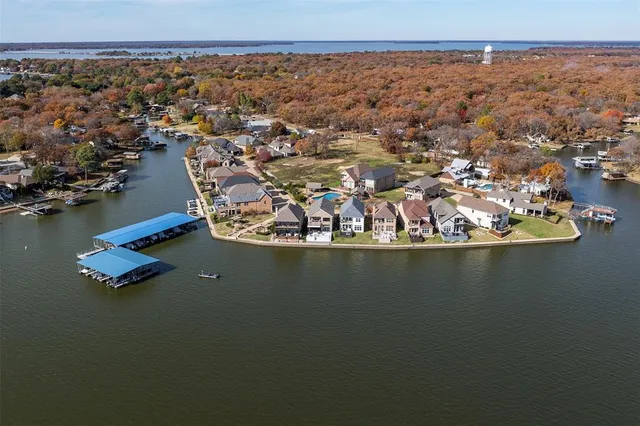 an aerial view of a house with a lake view