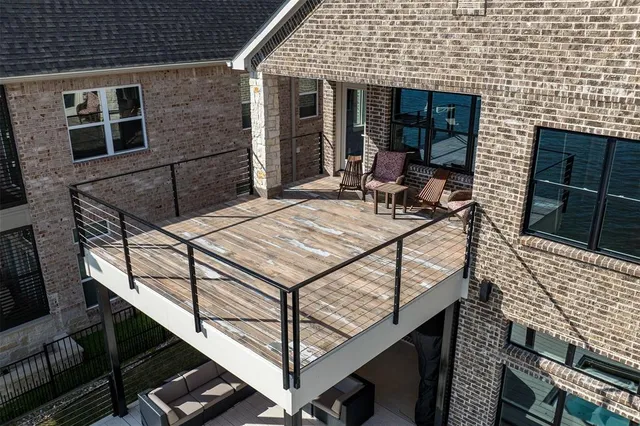 a view of a chairs and table in the balcony