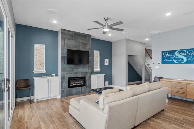 a living room with furniture and a fireplace