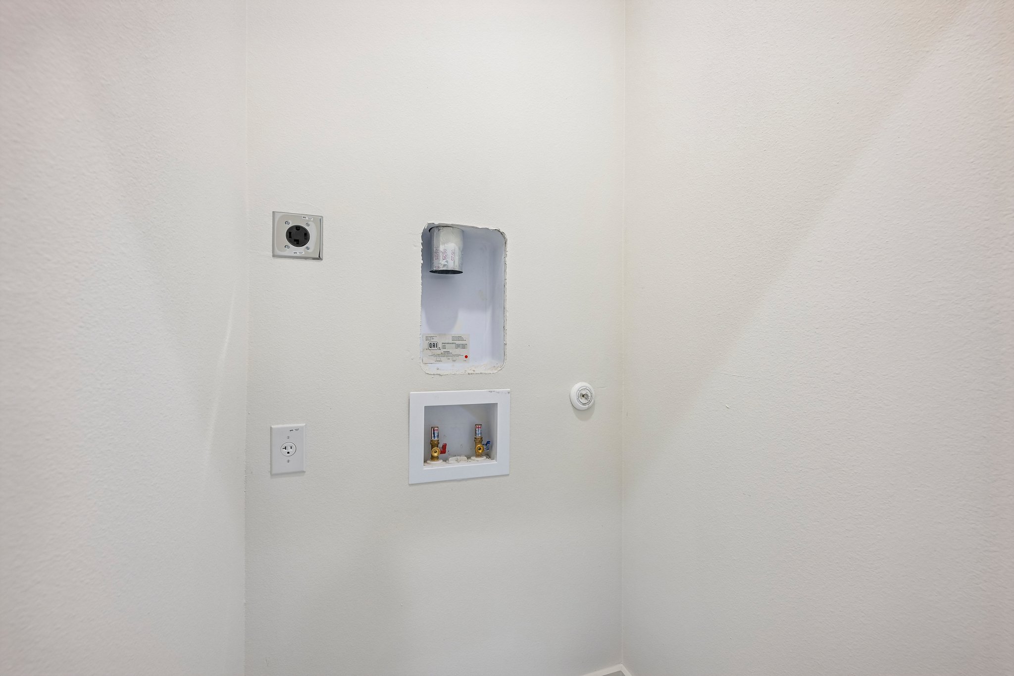 513 West Odell Street, Unit B Austin, TX 78752 - Photo 27 of 38 Ready for your appliances, this utility closet offers practical stackable washer/dryer hookups.