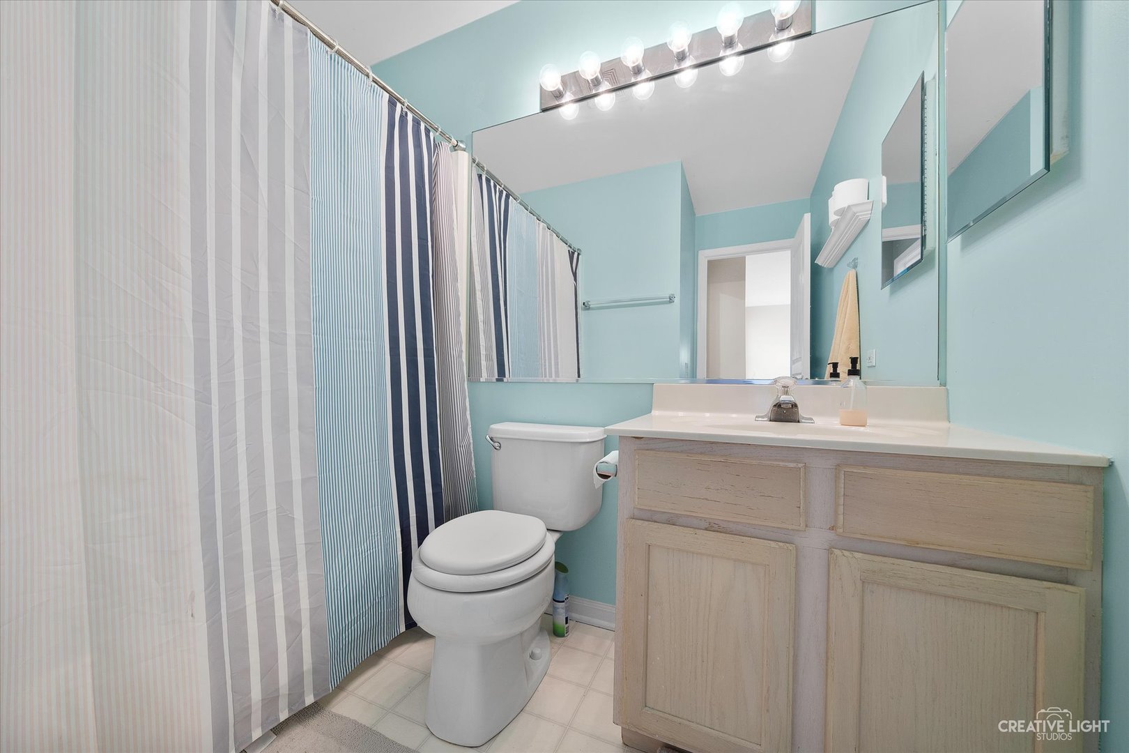 1369 Spaulding Road Bartlett, IL 60103 - Photo 13 of 15 a bathroom with a sink toilet and shower