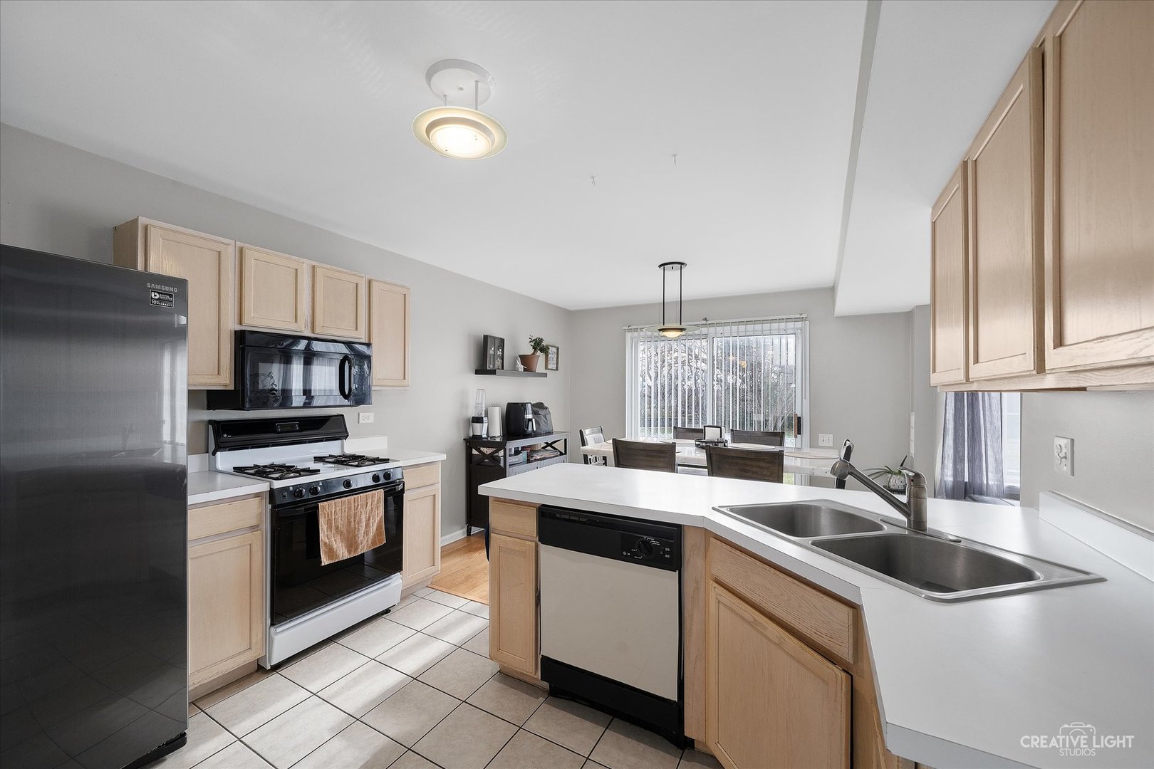 1369 Spaulding Road Bartlett, IL 60103 - Photo 6 of 15 a kitchen that has a sink and a stove in it