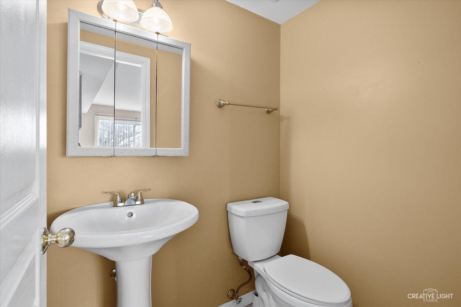 1369 Spaulding Road Bartlett, IL 60103 - Photo 7 of 15 a bathroom with a sink and a toilet
