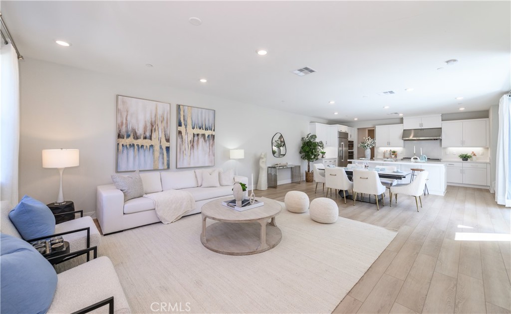 210 Chorus Irvine, CA 92618 - Photo 1 of 1 a living room with furniture and a table
