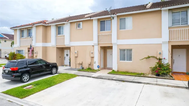 a car parked in front of a house
