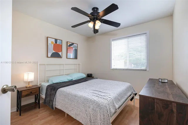 a bedroom with bed and a window