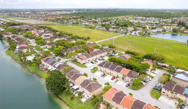 an aerial view of residential houses with outdoor space