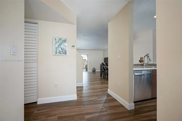 a view of a kitchen with wooden floor