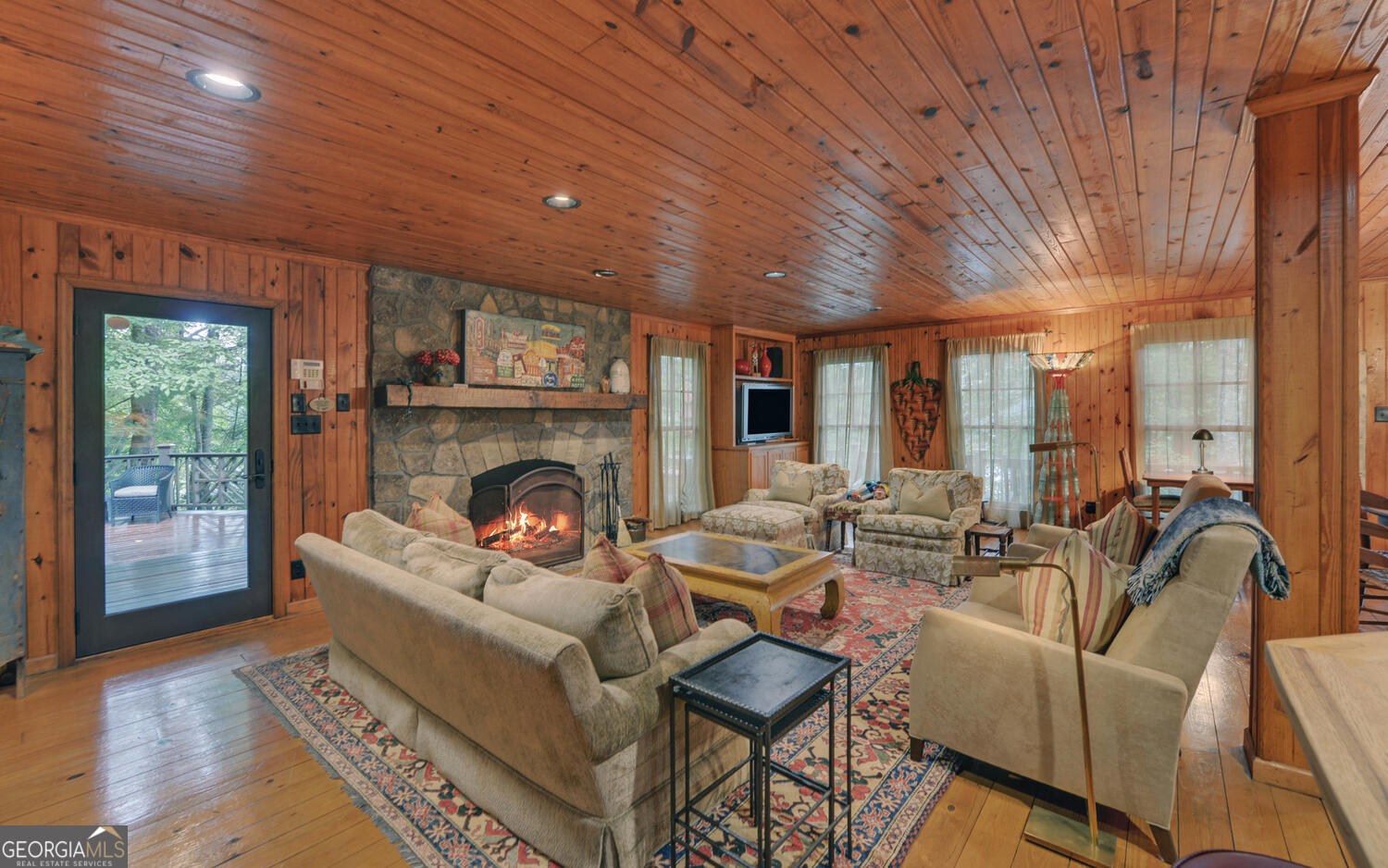 3540 Lake Rabun Road Lakemont, GA 30552 - Photo 6 of 81 a living room with furniture and a fireplace