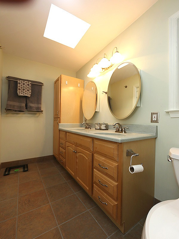 8320 Wheatstone Lane Raleigh, NC 27613 - Photo 14 of 23 Remodeled with tile shower, 2 sinks and plenty of cabinet space. Master Bathroom