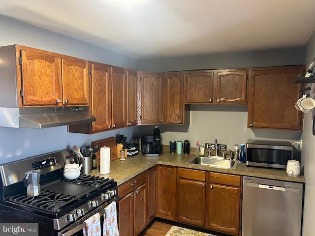 948 Easter Road Burlington, NJ 08016 - Photo 12 of 30 a kitchen with a stove a sink and a cabinets