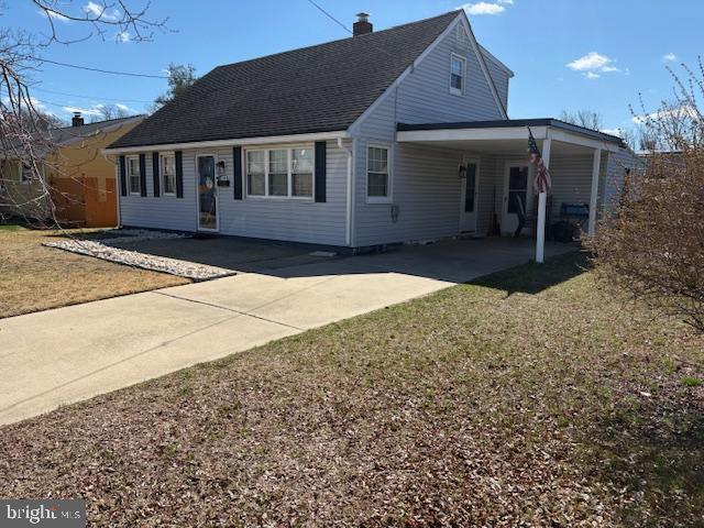 948 Easter Road Burlington, NJ 08016 - Photo 2 of 30 a front view of a house with a yard and garage