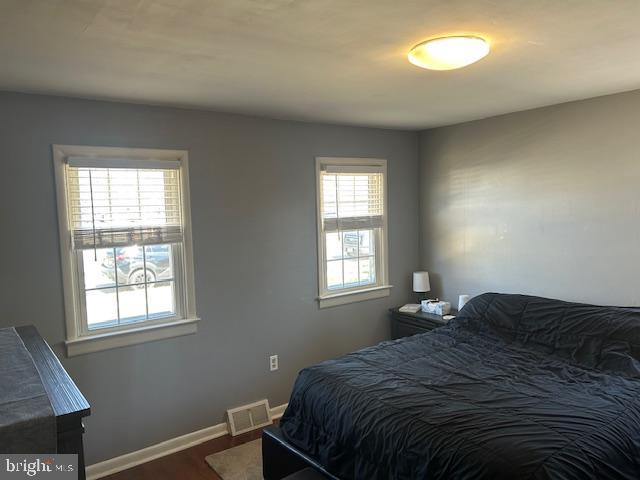 948 Easter Road Burlington, NJ 08016 - Photo 21 of 30 a bedroom with a bed window and chandelier