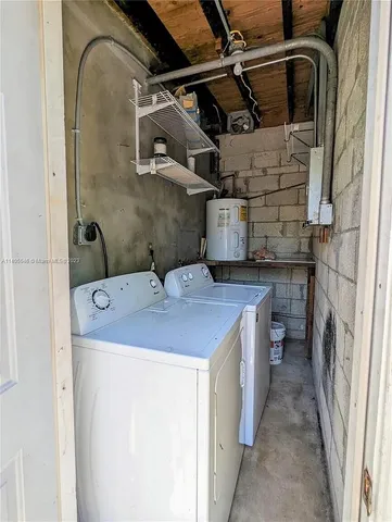 a utility room with a sink a washer and dryer