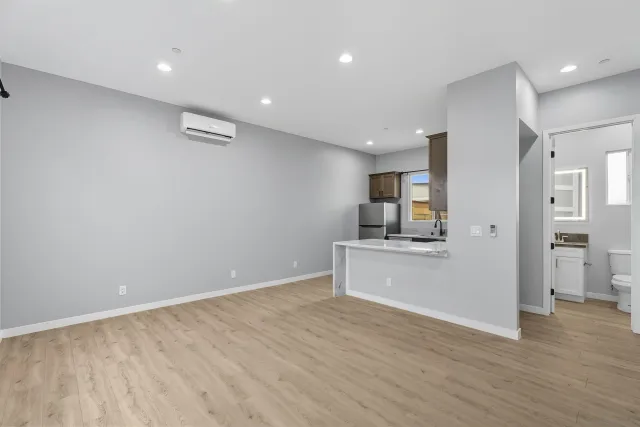 a kitchen with cabinets and steel stainless steel appliances