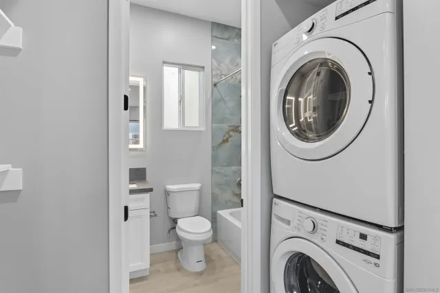 a view of a chairs and table in the backyard