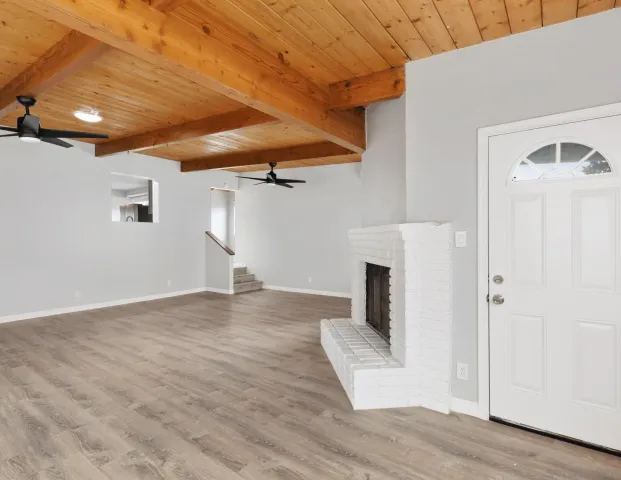 a kitchen with a sink and steel appliances
