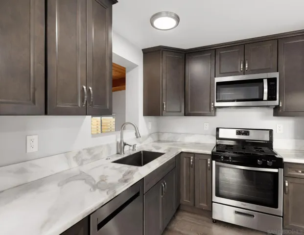 a view of livingroom with hardwood floor and ceiling fan