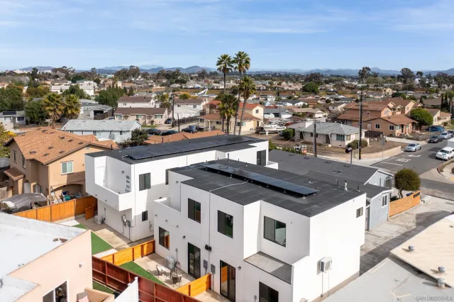 an aerial view of a house with a ocean view